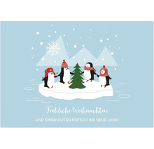 Weihnachtskarte mit Pinguinen die um einen Tannenbaum stehen in einer verschneiten Winterlandschaft mit Frohe Weihnachten Schriftzug.