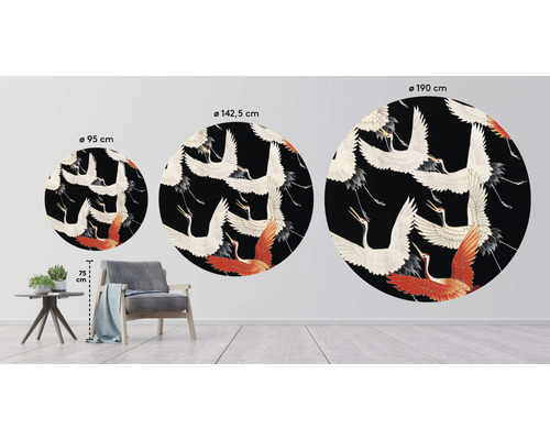 Drei runde Wandbilder mit Kranichmotiven in verschiedenen Größen, angeordnet in einem Wohnraum.