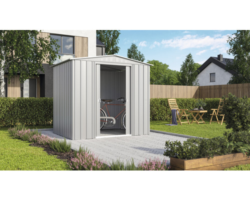 Garten Szene mit Gerätehaus aus Metall und einem Fahrrad darin.