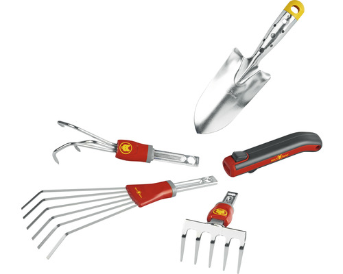 Verschiedene Gartenwerkzeuge wie eine Schaufel, ein Unkrautstecher, ein Fächerbesen, ein Kultivator und ein Messer.