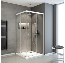 Eckdusche mit weißen Rahmen und Glaswänden in einem Badezimmer mit grauen Wänden.