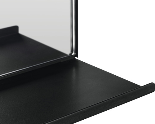 Detailansicht eines schwarzen Wandspiegels mit Ablage