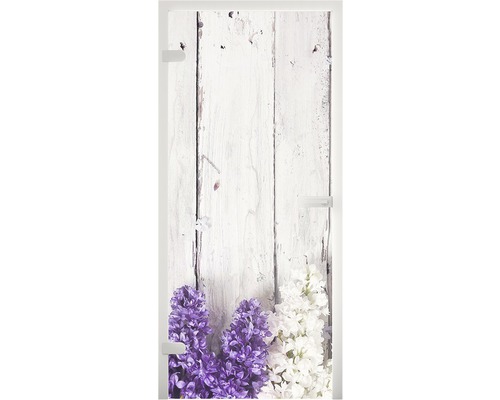 Glastür mit Blumenmotiv vor Holzhintergrund