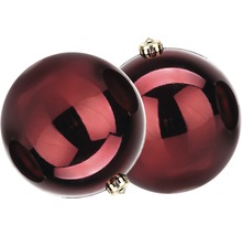 Zwei rote Weihnachtskugeln mit goldenen Aufhängern