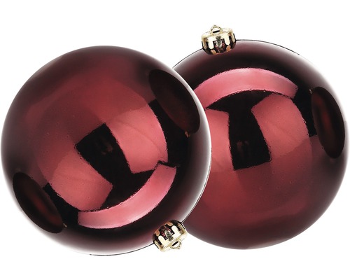 Zwei rote Weihnachtskugeln mit goldenen Aufhängern