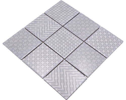 Muster aus quadratischen Fliesen mit verschiedenen geometrischen Motiven