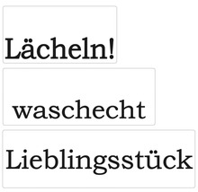 Aufkleber mit den deutschen Wörtern Lächeln, waschecht und Lieblingsstück