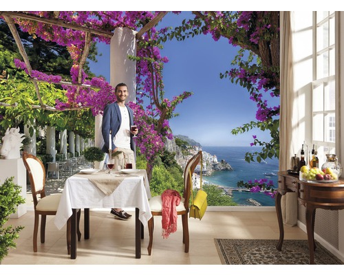 Fototapete mit Mann auf Terrasse mit Meerblick