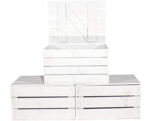 Drei weiße Holzkisten, eine mit Deckel