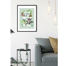 Gerahmtes Dschungelbuch-Poster mit dem Zitat ''Keep the wild in you'' als Dekoration im Wohnzimmer