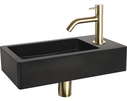 Schwarzes Aufsatzwaschbecken mit goldener Armatur