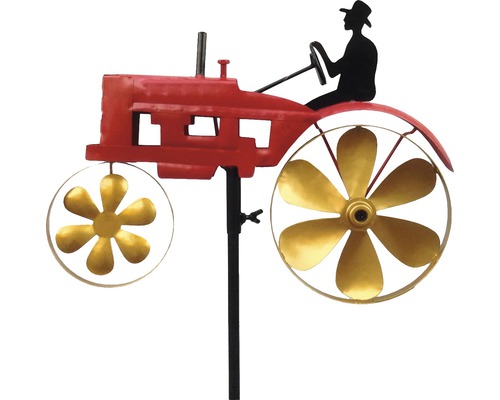 Windspiel mit rotem Traktor und Silhouette eines Fahrers