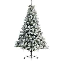 Künstlicher Weihnachtsbaum mit Schnee auf einem schwarzen Ständer.