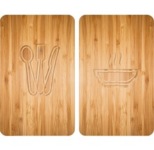 Zwei Holzbretter mit eingravierten Motiven: Besteck und eine Schüssel mit Dampf.