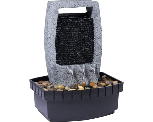 Dekorativer Zimmerbrunnen mit Steinoptik und Wasserlauf