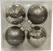 Vier dekorative Christbaumkugeln in einer Verpackung