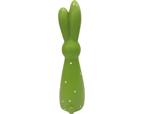 Dekorativer grüner Hase mit weißen Punkten als Osterdekoration