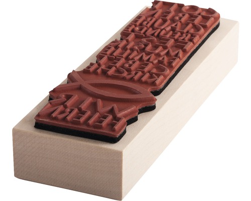 Stempel mit christlichem Motiv auf Holzsockel