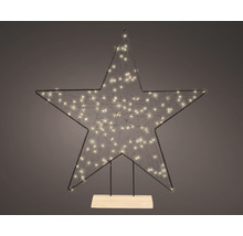 Dekorativer Stern mit Lichtern auf Holzsockel