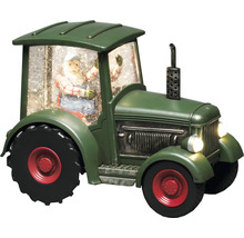 Dekorativer grüner Traktor mit Weihnachtsmannfigur und Schnee