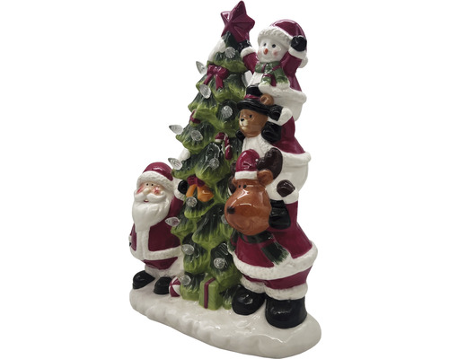 Weihnachtsdekoration mit Weihnachtsmann, Schneemann, Teddy und Rentier neben einem Weihnachtsbaum