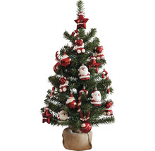 Geschmückter Weihnachtsbaum mit Stern, Zuckerstange, Teddybär und Weihnachtsmann Ornamenten in einem Jutesack