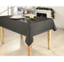 Esstisch mit grauer Tischdecke, Geschirr und Dekoration im Hintergrund