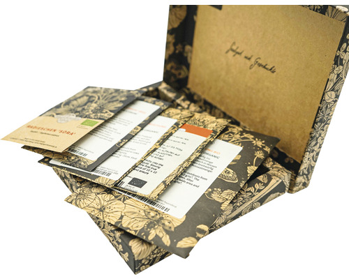 Offene Saatgutbox mit verschiedenen Samentüten