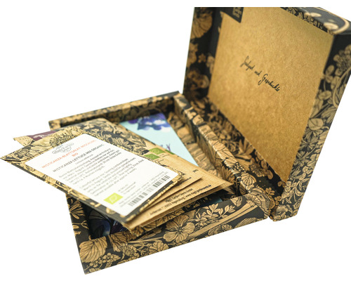 Geöffnete Box mit verschiedenen Saatguttüten für Pflanzen