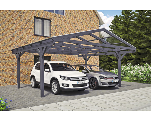 Doppelcarport aus Holz mit zwei geparkten Autos vor einem Backsteinhaus