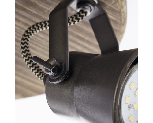 Detailaufnahme einer Deckenleuchte mit verstellbarem Spot und Textilkabel