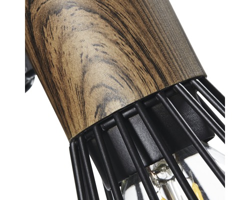 Detailaufnahme einer Lampe mit Holzelement und Metallkäfig