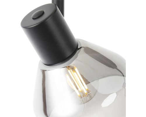 Detailaufnahme einer Pendelleuchte mit Leuchtmittel und grauer Glasabdeckung