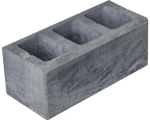 Grauer Betonblock mit drei Löchern