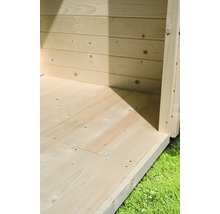 Detailansicht des Holzfußbodens und der Holzwand eines Gartenhauses.
