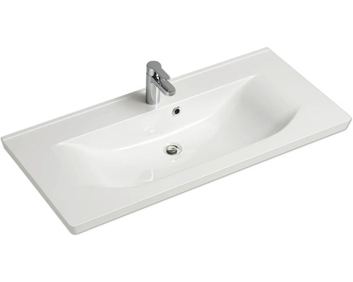Waschtisch mit Armatur für das Badezimmer.