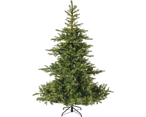 Künstlicher Weihnachtsbaum mit Beleuchtung auf einem Metallständer