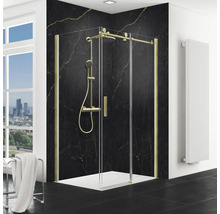 Eckdusche mit goldfarbenem Rahmen und schwarzer Marmorwand im Badezimmer.