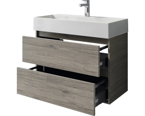 Waschtischunterschrank mit zwei offenen Schubladen und rechteckigem Aufsatzwaschbecken.