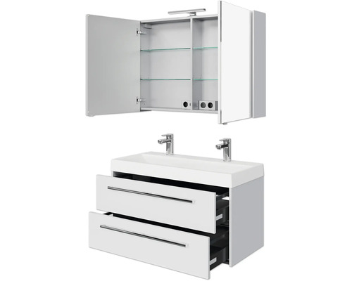 Weißer Waschtisch mit zwei Schubladen und Spiegelschrank mit geöffneter Tür und Regalböden