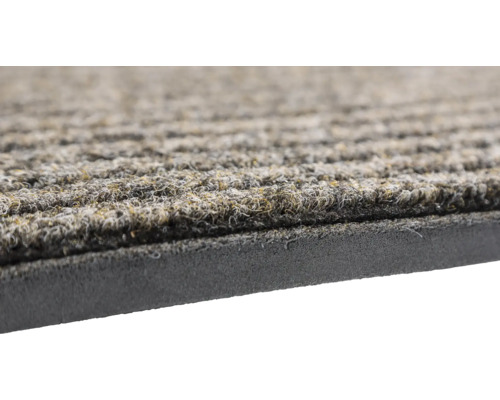 Detailansicht einer Fußmatte mit Rillenstruktur und Gummiunterseite