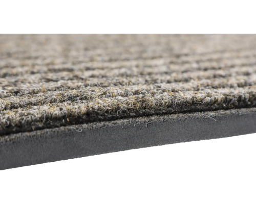 Detailansicht einer Fußmatte mit gerippter Struktur und einem Rücken aus Gummi