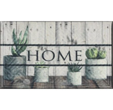 Fußmatte mit Pflanzenmotiven und der Aufschrift Zuhause