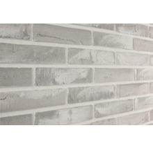 Nahaufnahme einer Wand mit Mauerziegeloptik