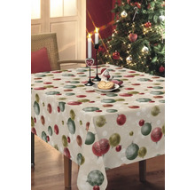 Tisch mit Weihnachtstischdecke mit Christbaumkugeldesign und Kerzen