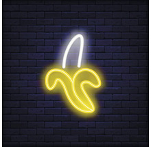 Neonlampe in Form einer Banane vor einer Ziegelwand