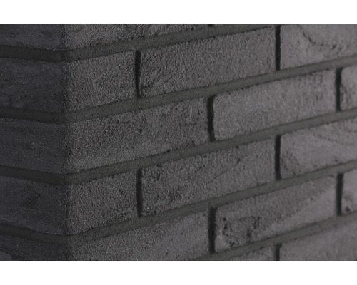 Nahaufnahme einer schwarzen Ziegelwand