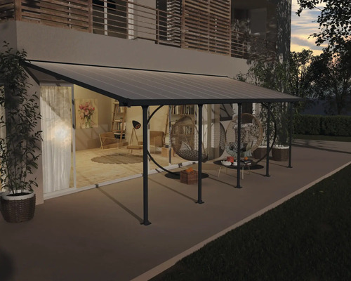 Terrassenüberdachung CANOPIA by Palram Feria 3x8.51 851 x 294 cm anthrazit Terrassenüberdachung aus Metall und Polycarbonat an einem Haus mit Gartenmöbeln
