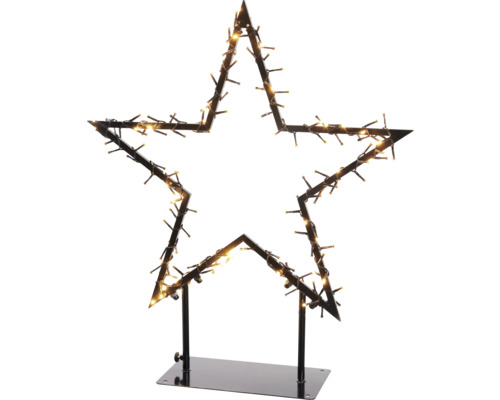 Sternförmige Weihnachtsdekoration mit Lichtern auf einem Ständer