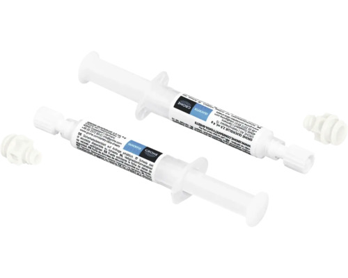 Zwei Grohe QuickGlue Klebstoffspritzen mit Verschlusskappe